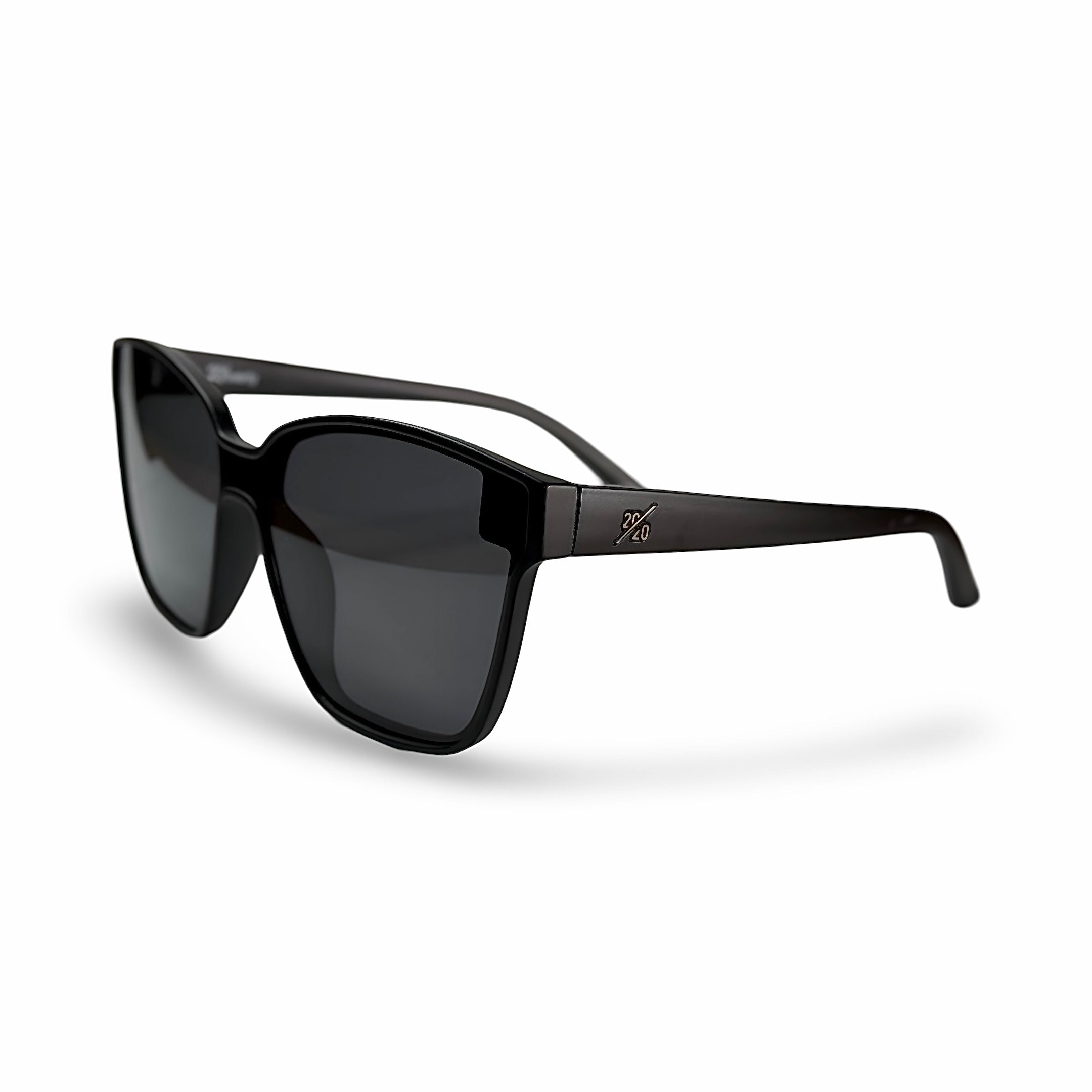 A pair of black-framed sunglasses featuring reflective silver lenses, resting on a flat surface.